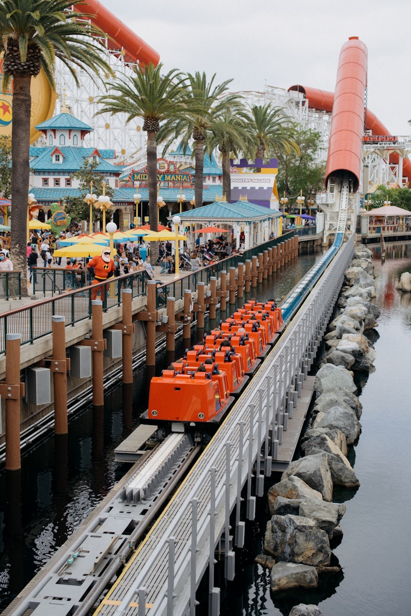 an amusement park with a train on the tracks